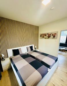 Postel nebo postele na pokoji v ubytování Apartmány LUXOR
