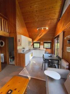 a kitchen and dining room of a tiny house at 3 Bedroom Lodge Lanteglos 1 in Lanteglos