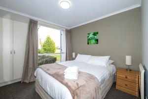 Voodi või voodid majutusasutuse Methven Nest Apartment toas