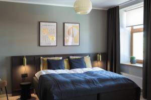 Postel nebo postele na pokoji v ubytování Centra Nams - Center Apartments