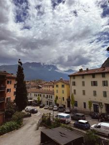 a city with cars parked in a parking lot at Apartment in town centre and nearby the lake in Riva del Garda