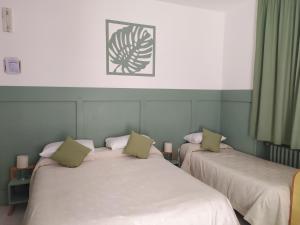 Postel nebo postele na pokoji v ubytování Albergo Mango
