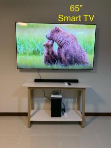 a flat screen tv sitting on top of a table at Condo Hotel near Mactan Cebu Airport in Mactan