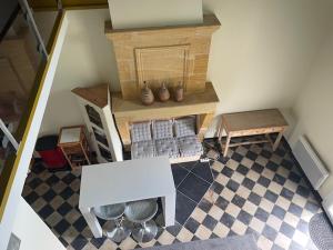 an overhead view of a room with a table and bench at Chez Nanou, à proximité de St Emilion in Sainte-Terre