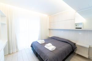 Postel nebo postele na pokoji v ubytování Hotel Nova