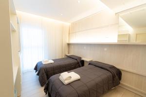 Postel nebo postele na pokoji v ubytování Hotel Nova