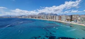 an aerial view of a beach and a city at Gemelos 28 in Benidorm