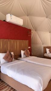 Säng eller sängar i ett rum på Wadi Rum desert magic