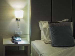 Cama ou camas em um quarto em THE ONE Grand Hotel da Póvoa - by MHMB Hospitality