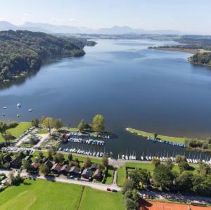 an aerial view of a lake with a resort at Hotel Berg in Seekirchen am Wallersee