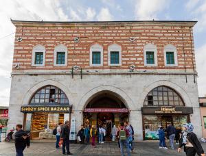 a group of people standing outside of a brick building at GalataCo Hotel in Istanbul