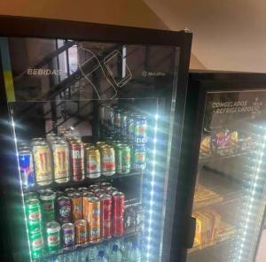 a refrigerator filled with lots of sodas and drinks at Hotel Live Logde Vila Mariana Pq Ibirapuera UH-511 in Sao Paulo