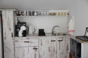 Kuchyň nebo kuchyňský kout v ubytování b&b Adamà