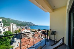 a balcony with a view of the ocean at The Dream Getaway & Spa by DeVasco in Becici