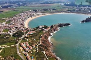 an aerial view of a village next to a beach at Silver Coast Holiday in Salir de Porto