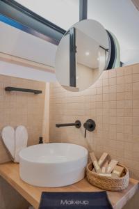 a bathroom with a white sink and a mirror at 1050 Mountain Living in Pávliani +21 photos