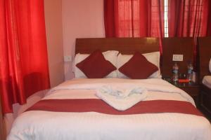 Ένα ή περισσότερα κρεβάτια σε δωμάτιο στο The hotel mountain Taplejung