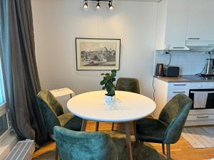 a dining room with a table and chairs at Sweet dreams Porvoo 2 in Porvoo