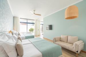 Studios by Aqua Natura Hotels客房内的一张或多张床位