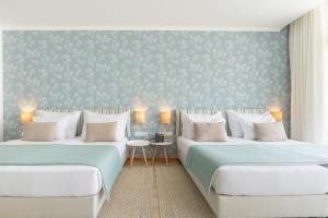 Studios by Aqua Natura Hotels客房内的一张或多张床位