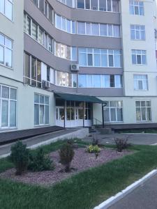 an apartment building with a large building at Light Apartments in Chernihiv
