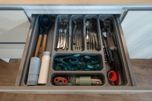 a drawer filled with utensils in a container at el Nido 14 in Hospitalet de l'Infant