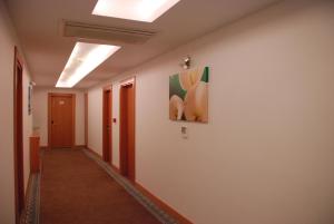 a hallway with a painting on the wall at Golden Palas Hotel in Cerkezkoy