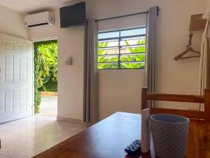 a room with a door leading to a patio at Sac Ek Hotel in Valladolid