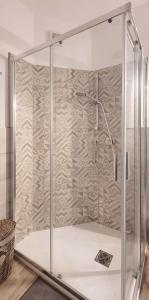 a shower with a glass enclosure in a bathroom at A casa di Alberta in Deiva Marina