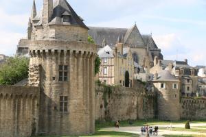 a castle with people walking in front of it at appartement au calme in Vannes