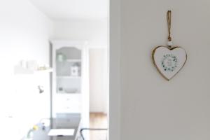 a heart ornament hanging on a wall in a room at Ferienwohnung Parkblick in Bad Herrenalb