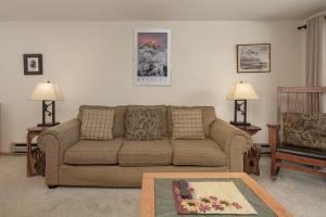 a living room with a couch and a chair at Beaver Village Unit #0712R in Winter Park