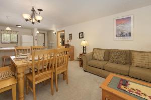 a living room with a couch and a table at Beaver Village Unit #0712R in Winter Park