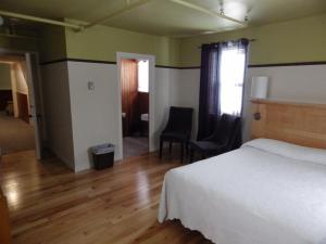 Postelja oz. postelje v sobi nastanitve Manoir Charlevoix