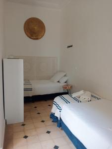 Voodi või voodid majutusasutuse Le riad de l'étoile ocre - COTG toas