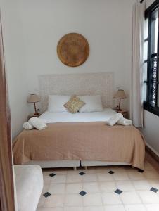 Voodi või voodid majutusasutuse Le riad de l'étoile ocre - COTG toas