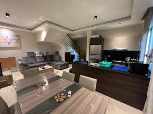 a kitchen and living room with a table and a couch at Azha Luxury vacation villa Ain sokhna - families only in Ain Sokhna