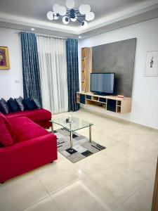 TV a/nebo společenská místnost v ubytování Charmant Appartement à Hammamet- Résidence Bousten 2