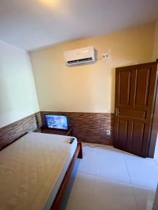 Postel nebo postele na pokoji v ubytování Casa com ar-condicionados e localização perfeita