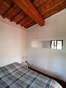 a bedroom with a bed and a window at Agriturismo Campolungo in Sant'Ermo