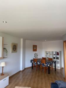 a dining room and living room with a table and chairs at Apartamento en Olvan 3 - ALBERGA in Olvan