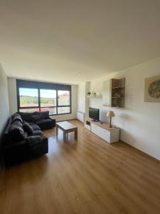 a living room with a couch and a table at Apartamento en Olvan 3 - ALBERGA in Olvan