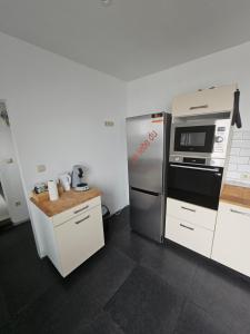Kuchyň nebo kuchyňský kout v ubytování appartement ouvert sur une pièce