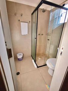 a bathroom with a shower and a toilet at Hotel Bella Paulista in Sao Paulo