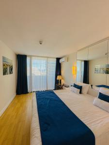Ένα ή περισσότερα κρεβάτια σε δωμάτιο στο Seaside vip Hotel