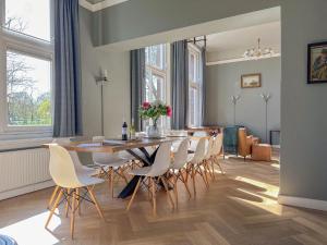 a dining room with a table and chairs at Grote Weeshuis in Enkhuizen +19 photos