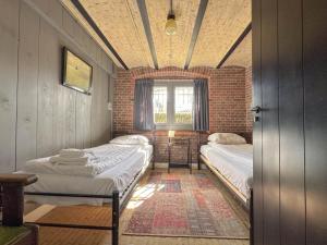 Un pat sau paturi într-o cameră la Weeshuis Groot