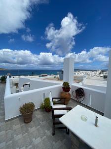 a balcony with a view of the ocean at Irene Rooms Naousa Parou in Naousa