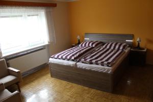 Ένα ή περισσότερα κρεβάτια σε δωμάτιο στο Chalupa pod Lysou horou