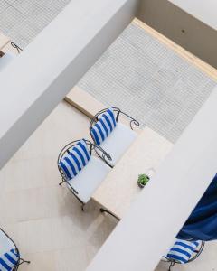 an overhead view of a table and chairs at Aegean Blue Beach Hotel in Nea Kalikratia